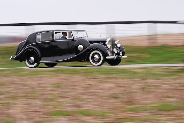 Mike Fowler drives a 1946 Rolls-Royce Silver Wraith from the The Rolls-Royce Foundation's collection in Mechanicsburg, Pa., Saturday, April 5, 2025. (AP Photo/Matt Rourke)
