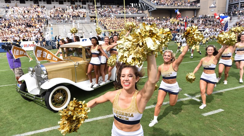 Georgia Tech’s Ramblin’ Wreck leads the band, cheerleaders, Buzz, players, and coaches before their game against the Tulane Green Wave at Bobby Dodd Stadium on Saturday, September 12, 2015. HYOSUB SHIN / HSHIN@AJC.COM