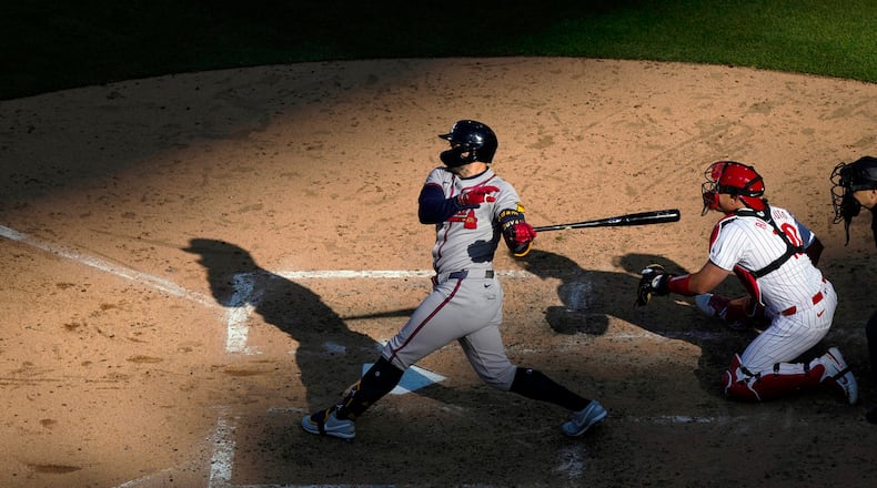 Atlanta Braves' Adam Duvall hits double two-run double off of Philadelphia Phillies' Jeff Hoffman during the seventh inning of an opening-day baseball game, Friday, March 29, 2024, in Philadelphia. (AP Photo/Matt Rourke)