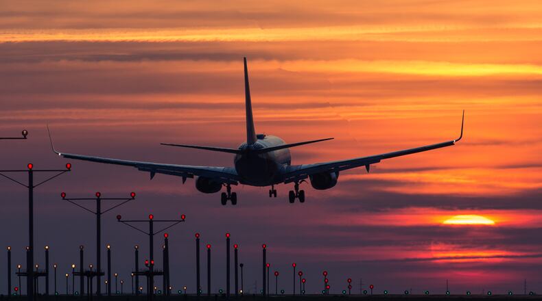 An airplane arrives at Hartsfield-Jackson Atlanta International Airport at sunrise, Thursday, March 24, 2016, in Atlanta. Following the Belgium bombings, U.S. cities and airports have raised security alerts. BRANDEN CAMP/SPECIAL