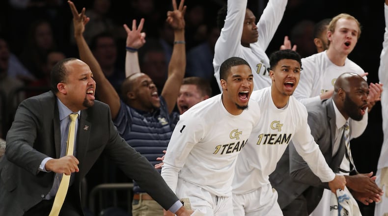 The Georgia Tech bench celebrates during its NIT semifinals win over Cal State Bakersfield in New York Tuesday night. (Associated Press)