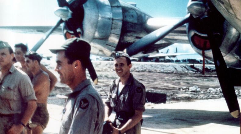 Handout photo of Capt. Theodore Van Kirk, center, as he and the rest of the crew return from the mission over Hiroshima, Japan Aug. 6, 1945. He was the navigator. Next to the left is Col. Paul Tibbetts, flight commander.
