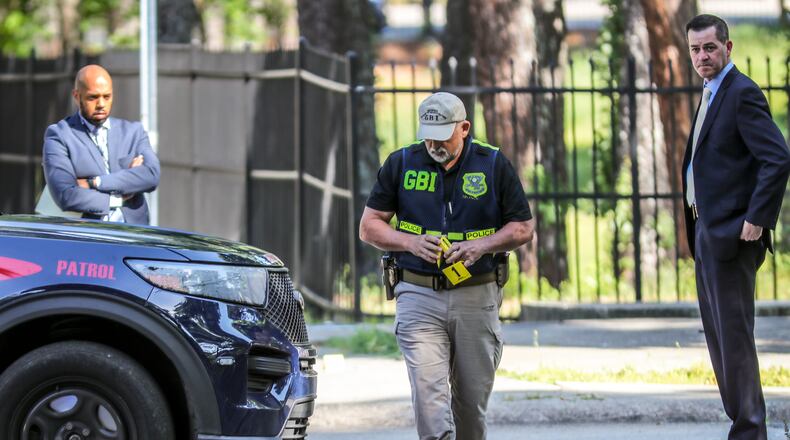 A GBI investigator on the scene of an officer-involved shooting in Atlanta on May 9. (John Spink / John.Spink@ajc.com)