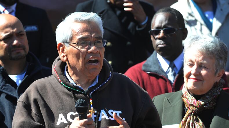 Eliseo Medina speaks as demonstrators with the "Fast for Families Across America" tour arrive at the MLK Jr. Historic Site in Atlanta Wednesday, March 26, 2014. The group drew national attention last year for fasting on the National Mall in support of a congressional overhaul of the immigration system. Now they've brought their campaign to Atlanta. Among the activists is Eliseo Medina, a former international secretary-treasurer of the Service Employees International Union. KENT D. JOHNSON / KDJOHNSON@AJC.COM