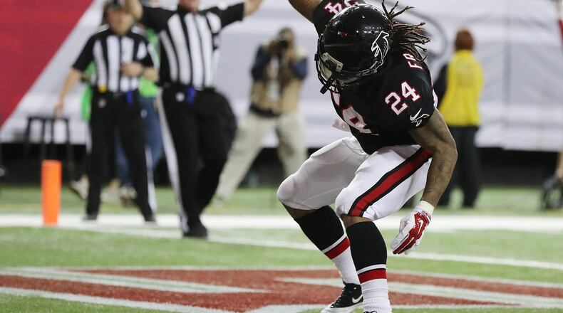 December 18, 2016, ATLANTA: Falcons running back Devonta Freeman spikes the ball scoring his second of three touchdowns for a 28-7 lead over the 49ers during the second quarter in an NFL football game on Sunday, Dec. 18, 2016, in Atlanta. Curtis Compton/ccompton@ajc.com