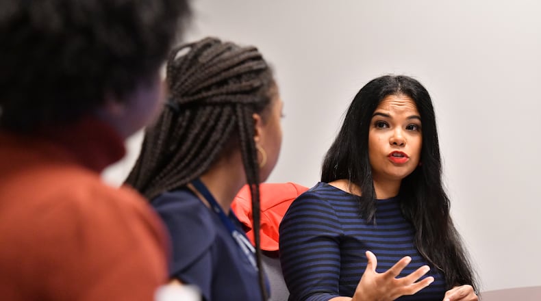 Dr. Natalie Hernandez, executive director, leads a meeting with her staff at Morehouse School of Medicine’s Center for Maternal Health Equity, Wednesday, Jan. 25, 2023, in Atlanta. (Hyosub Shin / Hyosub.Shin@ajc.com)