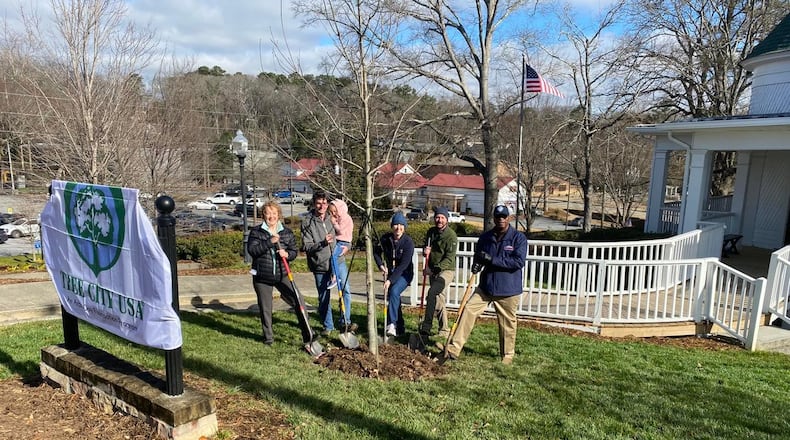 Pictured left to right at the Norcross Arbor Day tree planting are Tree Preservation Board Chair Charlotte Osborn, Councilmember Josh Bare, Community Development Director Tracy Rye, City Arborist Daniel Tew and Mayor Craig Newton. (Courtesy City of Norcross)