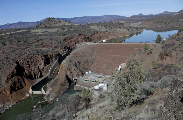 FILE - The Iron Gate Dam powerhouse and spillway are visible on the lower Klamath River near Hornbrook, Calif., on March 2, 2020. (AP Photo/Gillian Flaccus, File)