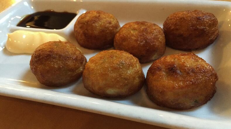 Samurai Noodle's takoyaki: six deep-fried balls with sauce and mayo. (Bethany Jean Clement/The Seattle Times/TNS)