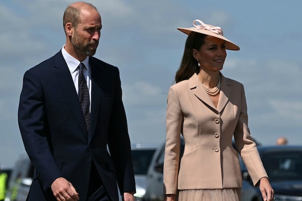 Britain's Prince William, and Britain's Kate, Princess of Wales arrive to greet France's President Emmanuel Macron and his wife Brigitte Macron, at RAF Northolt, west of London, Tuesday July 8, 2025, on the first day of a three-day state visit to Britain. (Justin Tallis/Pool via AP)