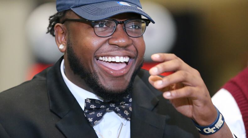 020216 ATLANTA: Grayson High School defensive tackle Chris Martin is all smiles sporting his Georgia Tech hat and bow tie during national signing day at the College Football Hall of Fame on Wednesday, Feb, 3, 2016, in Atlanta. Curtis Compton / ccompton@ajc.com