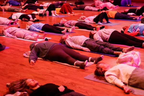 People participate in the Studio Theatre’s guided sound bath meditation on Monday, March 16, 2026, in Sandy Springs. Sound baths have moved beyond yoga studios and wellness centers. (Arvin Temkar/AJC)