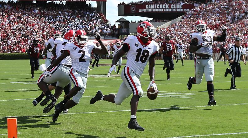 Georgia defensive back Deandre Baker would have had a touchdown on this interception return, if only he hadn't dropped the ball a half-step early. No matter, the Bulldogs comfortably beat South Carolina. (Curtis Compton/ccompton@ajc.com)