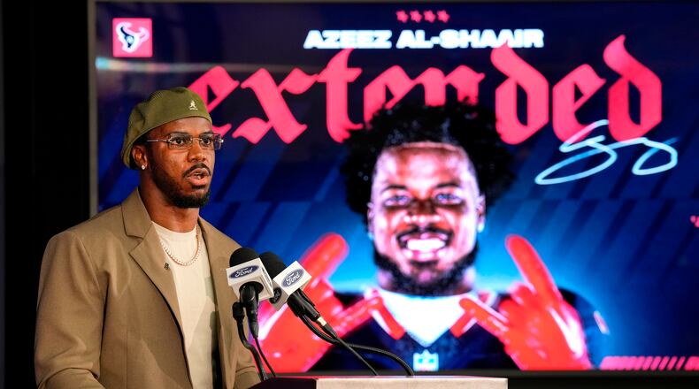 Houston Texans' Azeez Al-Shaair talks about his contract extension during a press conference at the NFL football team's facility, Friday, May 1, 2026, in Houston. (AP Photo/Karen Warren)