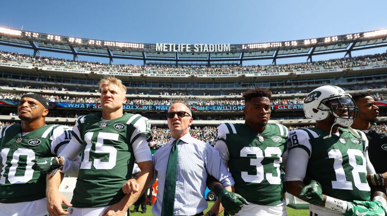 EAST RUTHERFORD, NJ - SEPTEMBER 24:  Jermaine Kearse #10, Josh McCown #15, Jamal Adams #33, ArDarius Stewart #18 and Christopher Johnson CEO of the New York Jets stand in unison with his team during the National Anthem prior to an NFL game against the Miami Dolphins at MetLife Stadium on September 24, 2017 in East Rutherford, New Jersey.  (Photo by Al Bello/Getty Images)