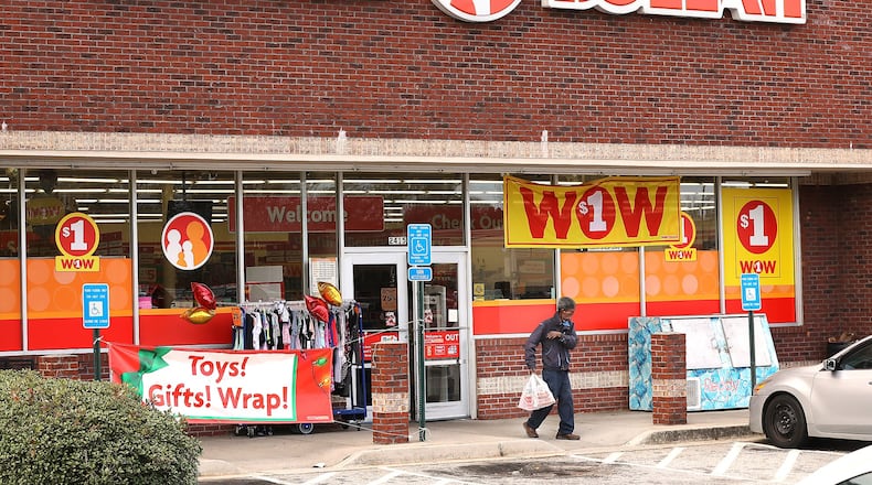 A customer leaves the Family Dollar at the intersection of Covington Highway and DeKalb Medical Parkway. Curtis Compton/ccompton@ajc.com