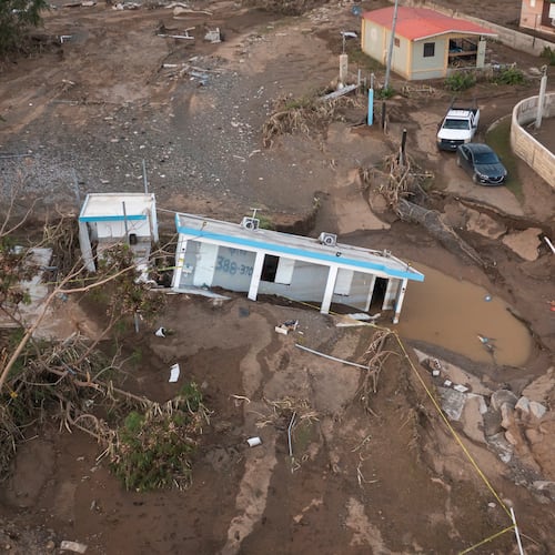 FILE - A house lays in the mud after it was washed away by Hurricane Fiona at Villa Esperanza in Salinas, Puerto Rico, Sept. 21, 2022. (AP Photo/Alejandro Granadillo)