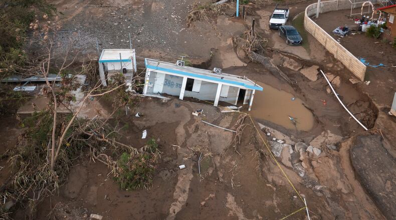 FILE - A house lays in the mud after it was washed away by Hurricane Fiona at Villa Esperanza in Salinas, Puerto Rico, Sept. 21, 2022. (AP Photo/Alejandro Granadillo)