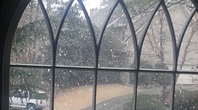 Snow started falling near Kennesaw about 2 p.m. MIKE MORRIS / MMORRIS@AJC.COM