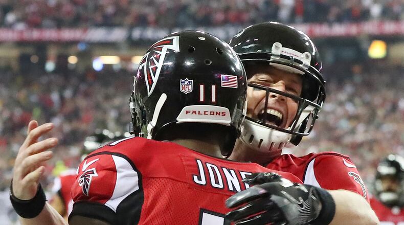 Soon to be bobbleheads? Matt Ryan and Julio Jones celebrate during last Sunday’s NFC Championship Game win over the Green Bay Packers. The victory vaulted the Falcons into the Super Bowl, which, if they win, will result in some of the team being immortalized as bobbleheads. Curtis Compton/AJC