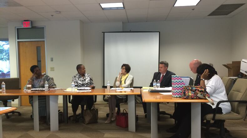 The DeKalb County Board of Ethics during its May 15 meeting. From left: Board members Edwinett Fay Perkins-Murphy, Clara Black-Delay, Susan Neugent and John Ernst; Gene Chapman, the board’s attorney; and Jennifer Johnson, the board’s administrator. MARK NIESSE / MARK.NIESSE@AJC.COM