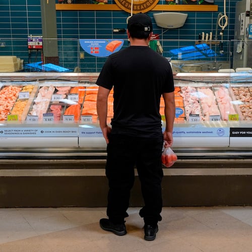 A person looks at the fresh fish at a grocery store Monday, May 11, 2026, in Nashville, Tenn. (AP Photo/George Walker IV)