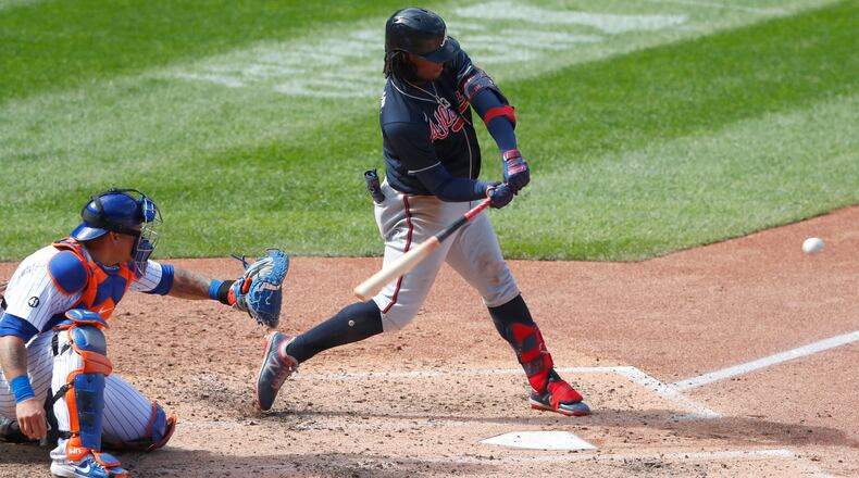 Braves outfielder Ronald Acuna hits a home run against the New York Mets during the sixth inning Sunday in New York. (Noah K. Murray/AP)