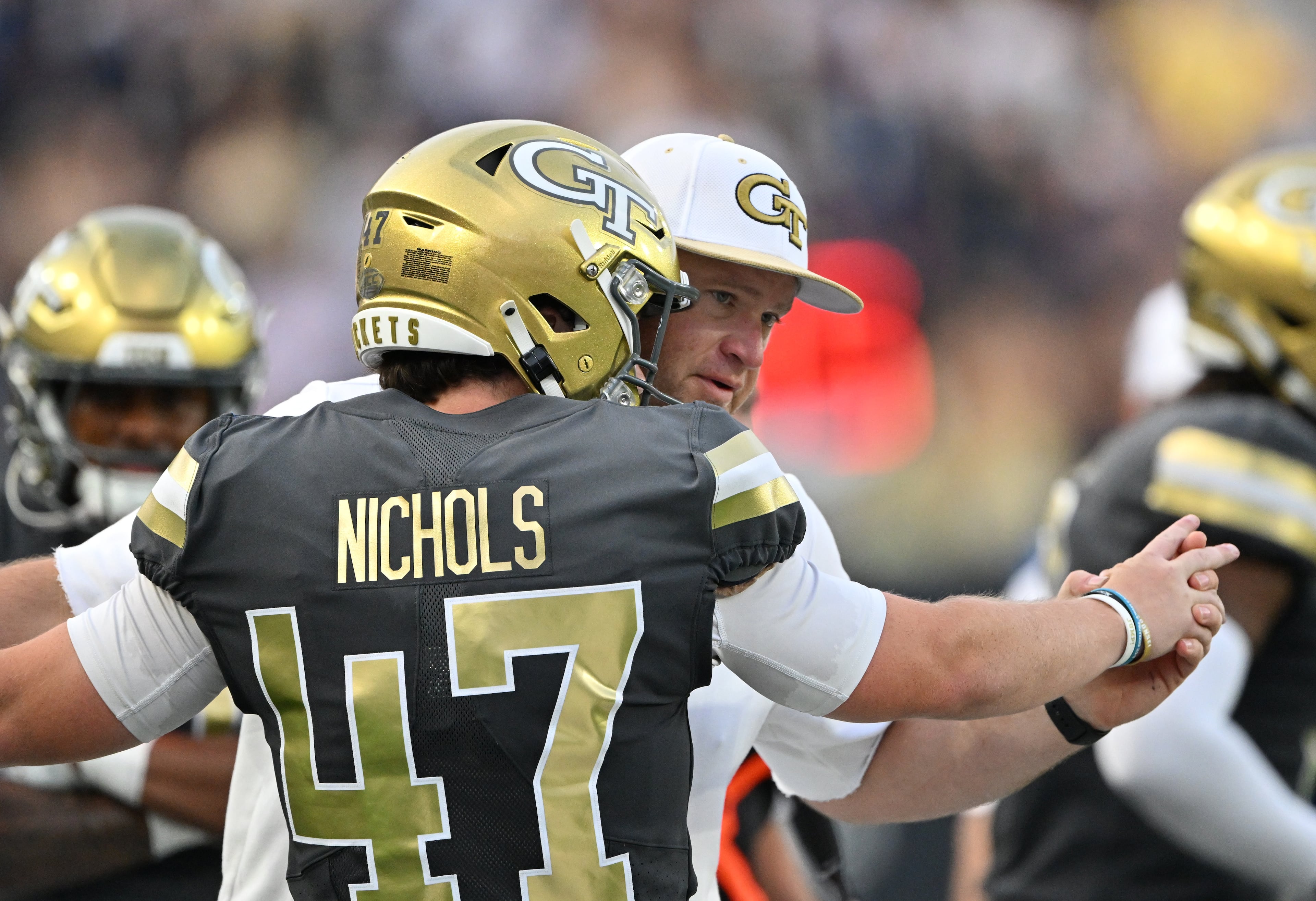 Georgia Tech head coach Brent Key advices Georgia Tech punter Marshall Nichols (47) during the second half of an NCAA college football game at Georgia Tech's Bobby Dodd Stadium, Saturday, November 20, 2025 in Atlanta. Georgia Tech won 45-24 over Temple. (Hyosub Shin / AJC)