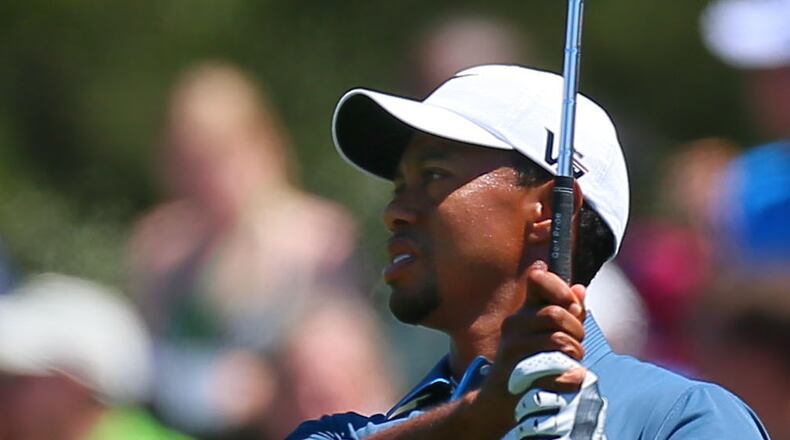 Tiger Woods hits on the practice range before taking the course during the third round in the Masters Tournament on Saturday April 13 2013. Woods was assessed a two-stroke penalty in Friday's play for an improper drop after his ball hit the flag stick and rolled back into the water on the #15 green. CURTIS COMPTON / CCOMPTON@AJC.COM