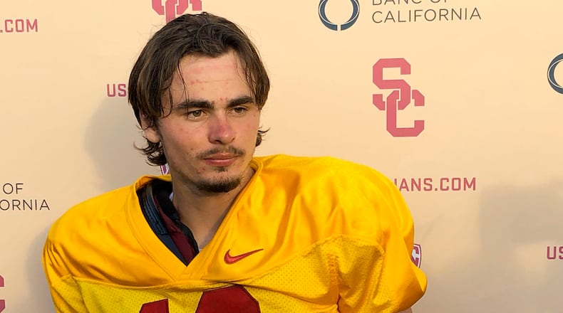 Southern California quarterback J.T. Daniels listens to reporters following his first practice after winning the Trojans' starting job, Tuesday, Aug. 28, 2018, in Los Angeles.