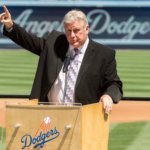 FILE - Los Angeles Dodgers former pitcher Tommy John praises his late friend, Dr. Frank Jobe during a memorial service at Dodger Stadium in Los Angeles, April 7, 2014. (AP Photo/Damian Dovarganes, File)