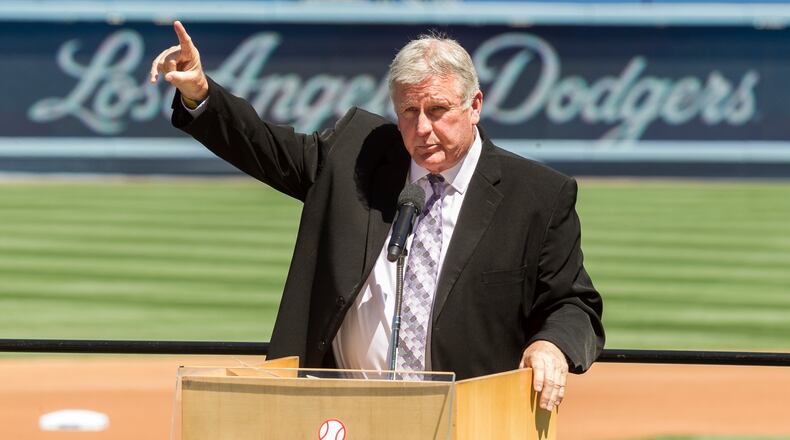 FILE - Los Angeles Dodgers former pitcher Tommy John praises his late friend, Dr. Frank Jobe during a memorial service at Dodger Stadium in Los Angeles, April 7, 2014. (AP Photo/Damian Dovarganes, File)