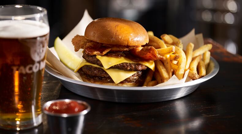 Head to Taco Mac for an original burger and beer for $9.95 or upgrade to this bacon burger for a buck. HANDOUT / Melissa Libby & Associates.
