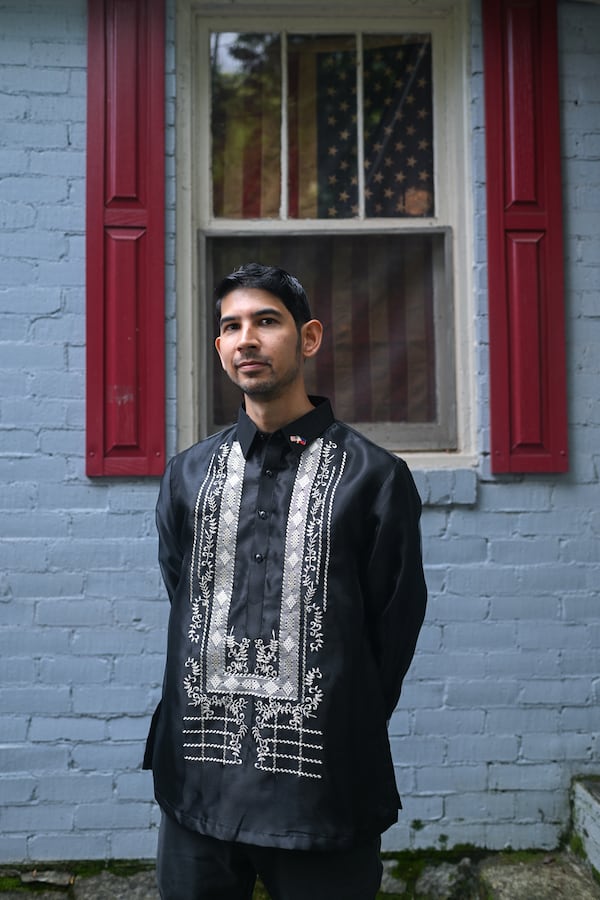 Arvin Temkar, 39, wears a barong in front of his home in Atlanta. (Natrice Miller/AJC)