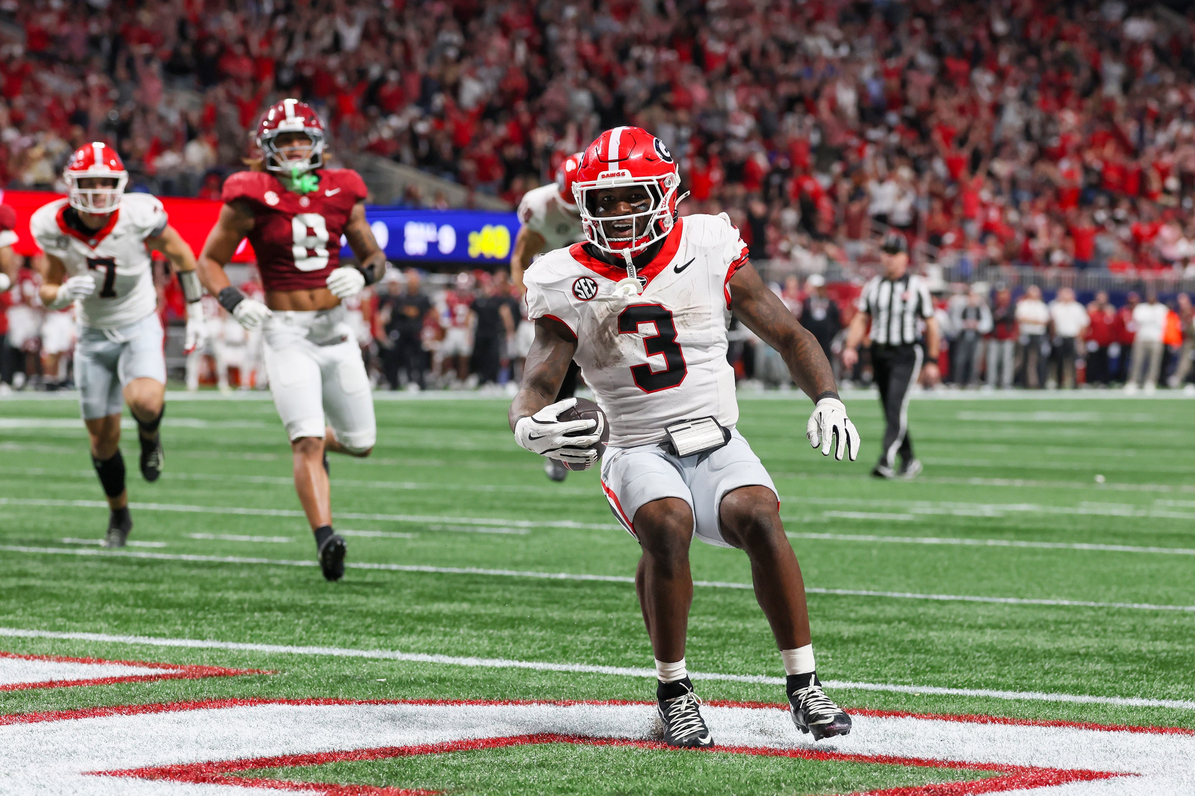 Georgia running back Nate Frazier (3) rushes for a nine yard touchdown against Alabama during the third quarter of the SEC Championship game at Mercedes-Benz Stadium, Saturday, Dec. 6, 2025, in Atlanta. (Jason Getz / AJC)