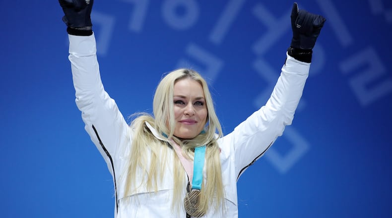 PYEONGCHANG-GUN, SOUTH KOREA - FEBRUARY 21:  Bronze medallist Lindsey Vonn of the United States celebrates during the medal ceremony for the Ladies' Downhill on day twelve of the PyeongChang 2018 Winter Olympic Games at Medal Plaza on February 21, 2018 in Pyeongchang-gun, South Korea.  (Photo by Andreas Rentz/Getty Images)
