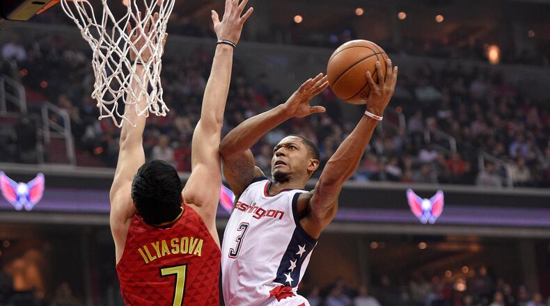 Wizards guard Bradley Beal goes to the basket against Hawks forward Ersan Ilyasova during the first half in Game 5 of a first-round NBA basketball playoff series, Wednesday, April 26, 2017, in Washington. (AP Photo/Nick Wass)