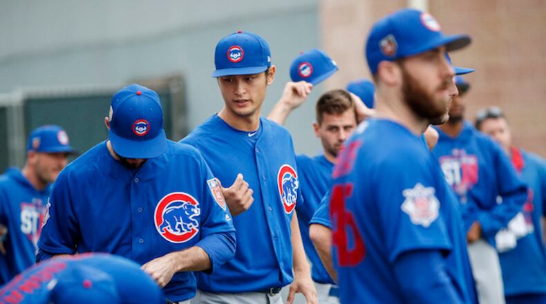 Chicago Cubs pitcher Yu Darvish talks with other players during the first day of pitchers and catchers practice at Sloan Park during Cubs spring training Wednesday Feb. 14, 2018, in Mesa, Ariz. (Armando L. Sanchez/Chicago Tribune/TNS)