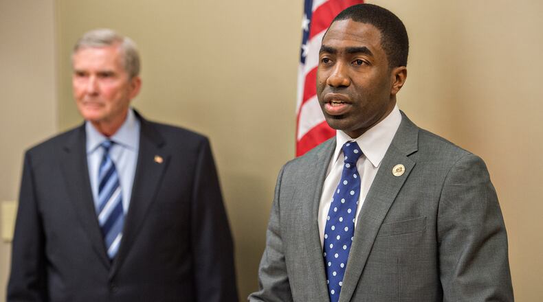 Dekalb County CEO Lee May (right) holds a press conference at the Balch & Bingham offices in Atlanta naming former GA Attorney General Mike Bowers a special investigator for 120 days on Wednesday, March 18, 2015. Bowers has been called in to investigate corruption in DeKalb County. JONATHAN PHILLIPS / SPECIAL