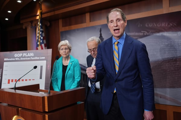 Sen. Ron Wyden, D-Ore., the ranking member of the Senate Finance Committee, is joined at left by Sen. Elizabeth Warren, D-Mass., ranking member of the Senate Banking, Housing, and Urban Affairs Committee, and Senate Minority Leader Chuck Schumer, D-N.Y., as they talk to reporters about Senate Republicans' efforts to pass President Donald Trump's tax cut and spending agenda with deeper Medicaid cuts, at the Capitol in Washington, Wednesday, June 18, 2025. (AP Photo/J. Scott Applewhite)