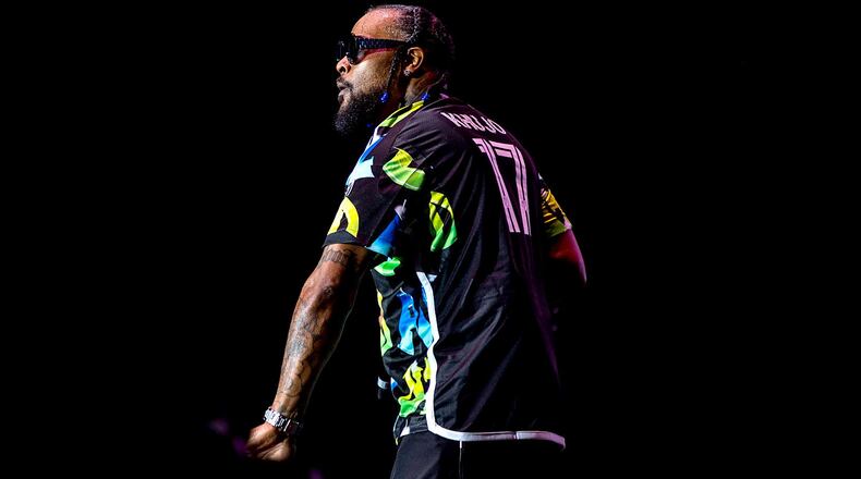 Goodie Mob member Khujo dons the Atlanta United's new kit while performing on stage for the city's 50th Anniversary hip-hop concert at Lakewood Amphitheater Sunday, August 13, 2023. The franchise confirmed Monday that the kit is authentic. (KYMANI YASIR CULMER/Contributor