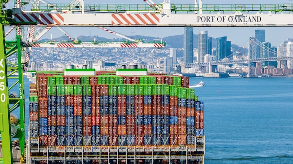 Shipping containers line the Ever Most cargo vessel docked at the Port of Oakland on Thursday, April 3, 2025, in Oakland, Calif. (AP Photo/Noah Berger)