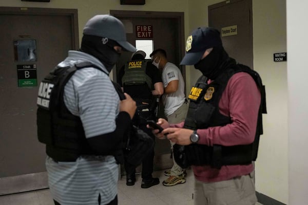 Federal agents talk to each other outside immigration court at the Jacob K. Javits federal building on Thursday, July 3, 2025, in New York. (AP Photo/Yuki Iwamura)