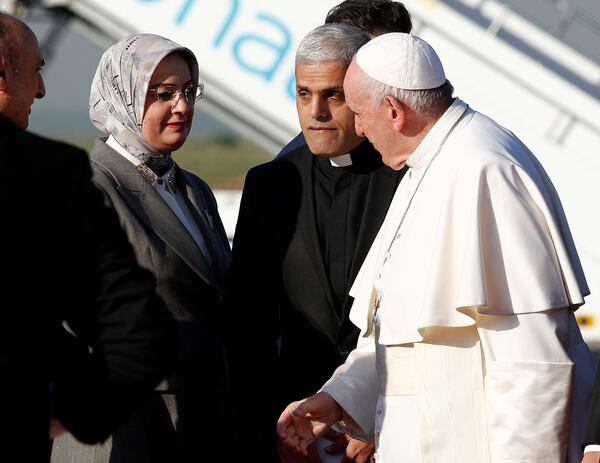FILE - Pope Francis is welcomed as he arrives at Irbil airport, Iraq, March 7, 2021. (AP Photo/Hadi Mizban, file)
