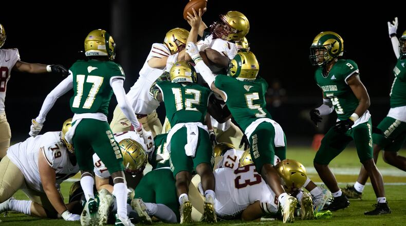 Brookwood carries the ball to the top of pile during a GHSA high school football game between the Grayson Rams and the Brookwood Broncos at Grayson High School in Loganville, Ga. on Friday, October 22, 2021. (Jenn Finch/Special to the AJC)