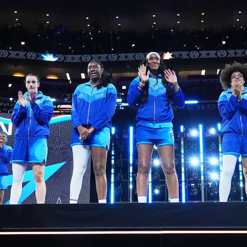 Left to right; Team Spoon's Caitlin Clark, Aliyah Boston, A'Ja Wilson, Olivia Miles and Jessica Shepard greet fans before a WNBA All-Star basketball game against Team Coop in Chicago, Saturday, July 25, 2026. (AP Photo/Nam Y. Huh)