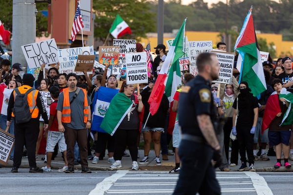 Demonstrators protest ICE raids and deportations on Buford Highway in Atlanta on Tuesday, June 10, 2025. (Arvin Temkar / AJC)