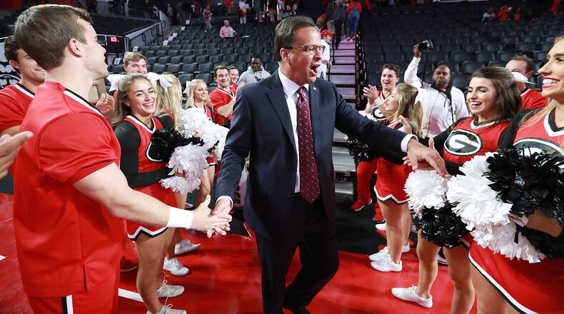Georgia coach Tom Crean thanks the cheerleaders for their support and for firing up the crowd after a 84-51 victory over Kennesaw State on Tuesday, Nov. 27, 2018, in Athens. Curtis Compton/ccompton@ajc.com