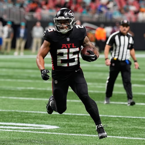 Atlanta Falcons running back Tyler Allgeier (25) runs to score a touchdown during the second half of an NFL football game against the Miami Dolphins, Sunday, Oct. 26, 2025, in Atlanta. (AP Photo/Mike Stewart)