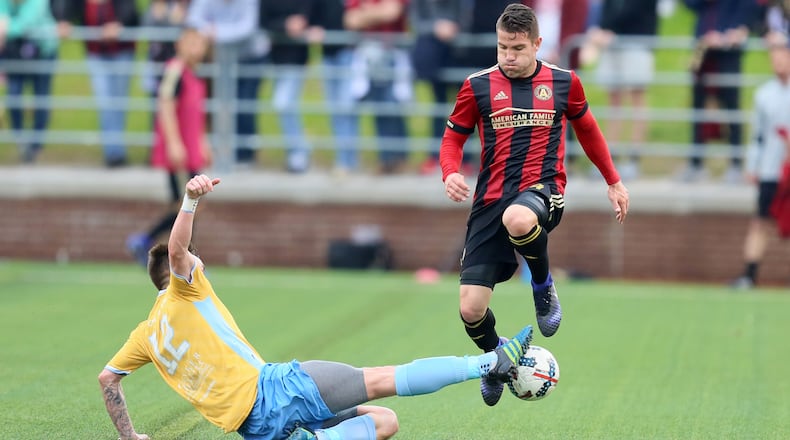 Atlanta United defender Greg Garza (4) make it thru a Chattanooga forward during a game last season.